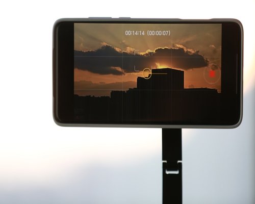 Close-up of adjusting smartphone screen brightness slider
