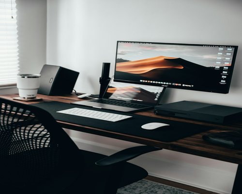 Ergonomic desk setup with an external monitor and keyboard